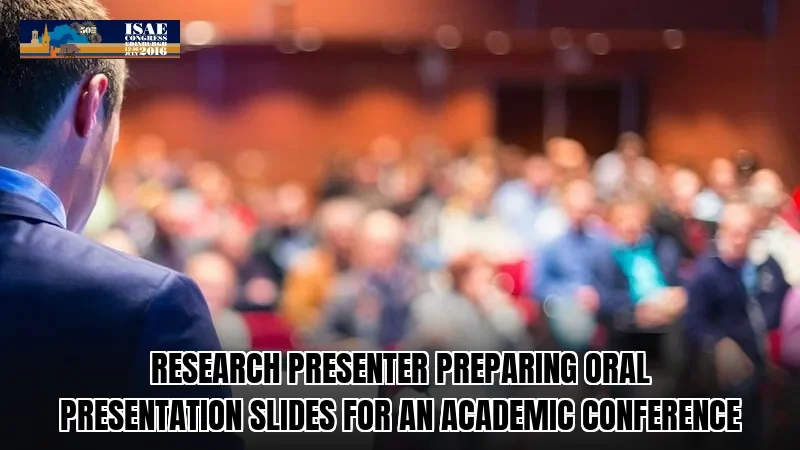Research presenter preparing oral presentation slides for an academic conference